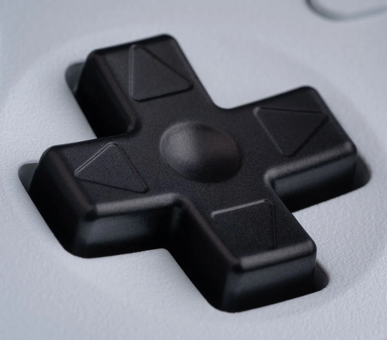 Close-up of the 8BitDo Ultimate 2 raised D-pad
