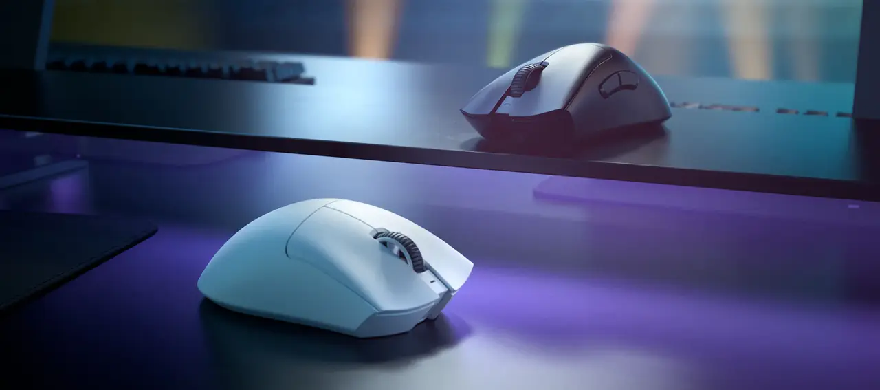 Two Razer DeathAdder V3 Pro mice, one white and one black, showing the high-arched ergonomic shell