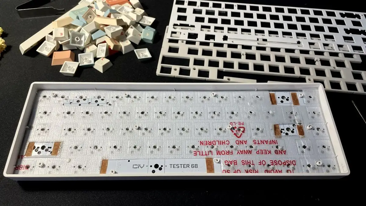 PE foam layer fitted over a keyboard PCB during a foam mod