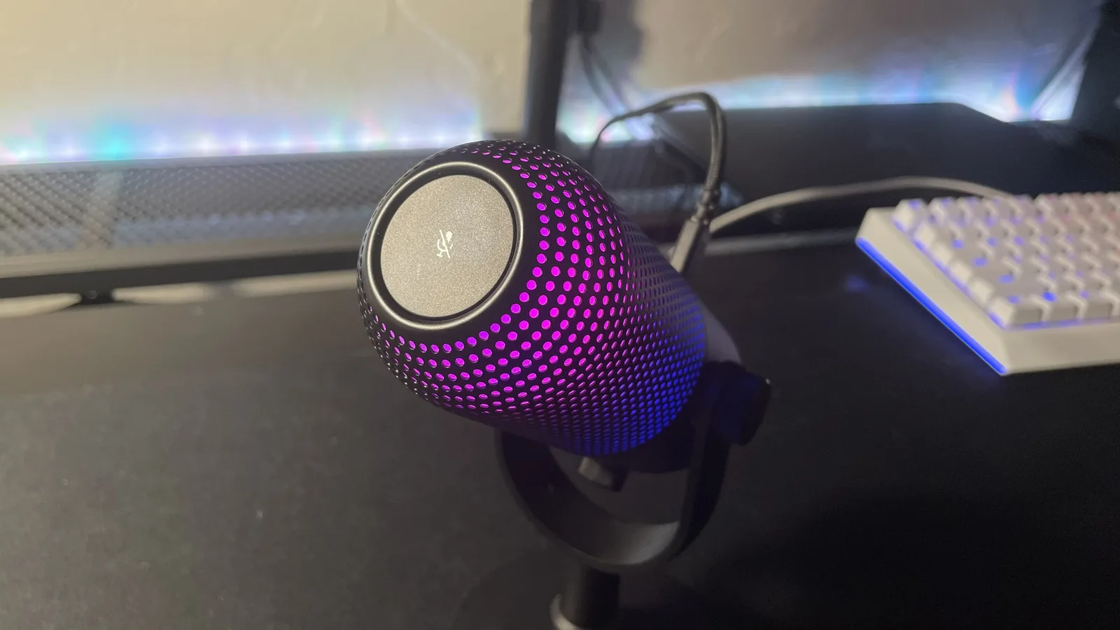 Top of the Razer Seiren V3 Chroma showing the tap-to-mute sensor with a purple lit grille