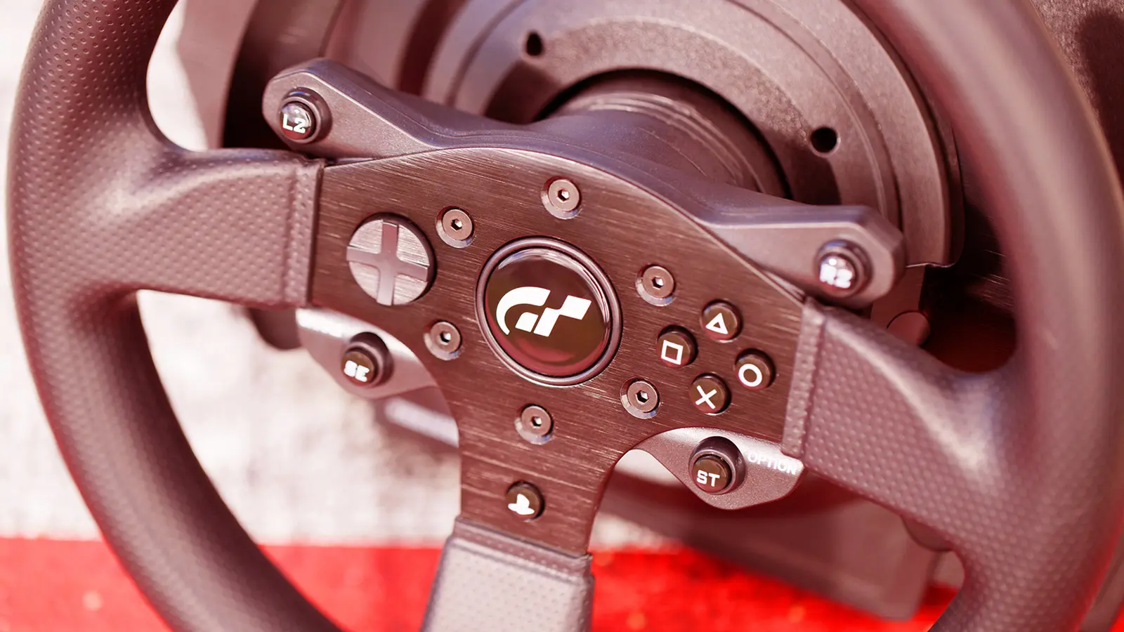 Close-up of the Gran Turismo rim with D-pad, face buttons and shoulder buttons