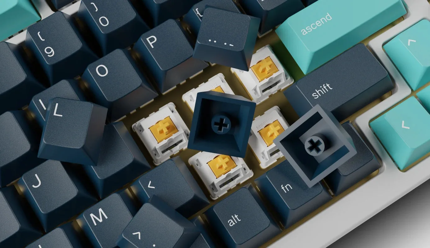 Keyboard switches with cross-shaped stems beside keycaps showing the matching cross-shaped holes