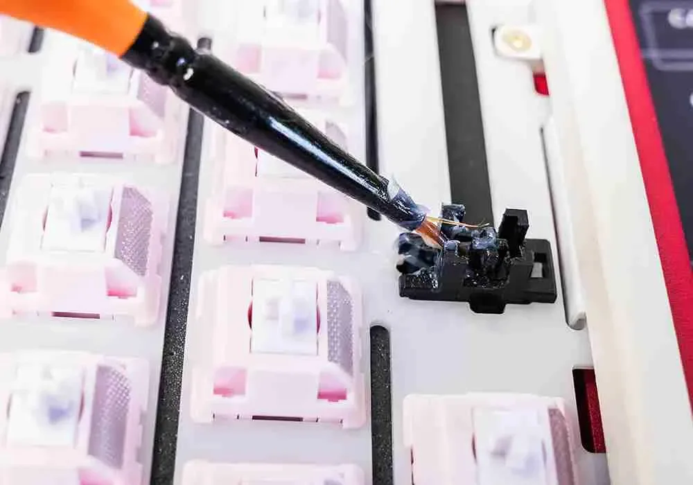 Lube being brushed onto a keyboard stabilizer