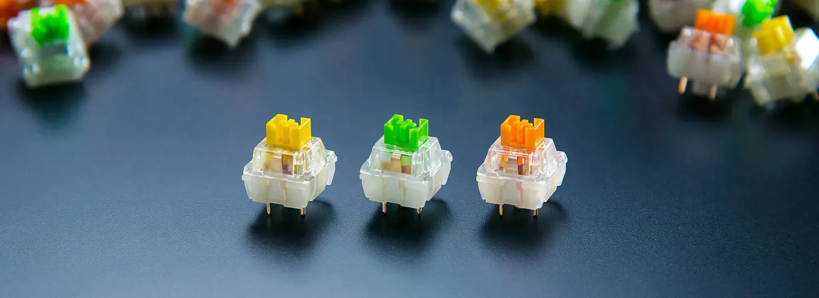Razer Yellow, Green and Orange mechanical switches side by side