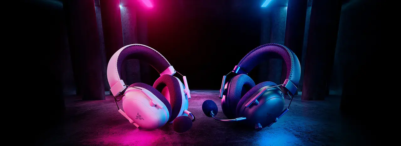 Razer BlackShark V2 Pro in white and black shown side by side with earcups and boom mic